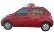 автомобиль Ниссан красного цвета с эксклюзивным золтым бантом на крыше, упаковка машин оформление авто бант на автомобиль